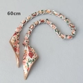 Detailed macro view of a 60cm silver metal chain woven with floral silk scarf for handbags - Cream Red Yellow Floral Style (4) / Silver