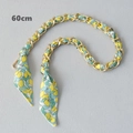Detail showing a 60cm golden metal chain interwoven with lemon pattern fabric strap - Style 5-Gold (Lemon Green Leaf)