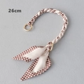 Détail de la chaîne de sac de 26cm avec motif pied-de-poule et boucles dorées chic - 26cm / Pied-de-poule Café