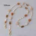 Detail of 120cm acrylic bead strap with amber teardrop charms and gold lobster clasps - 120cm