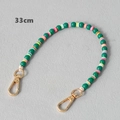 Detailed view of a 33cm acrylic and clay bead strap with gold lobster clasps - Green-33CM