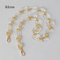 Detail view of 82cm transparent acrylic chain with golden links and lobster clasps - 82cm / Clear