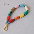 Detail of 27cm acrylic bead strap featuring colorful marble patterns and golden clasp - 27cm