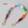 Detailed view of a 34cm colorful acrylic beaded chain with golden lobster clasps - 34cm