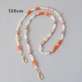 Détail de la bandoulière en perles acryliques de 120 cm avec fermoirs dorés pour sacs - Série Orange 120CM