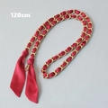 Detail of 120cm red silk scarf woven through a golden metal chain handbag strap - Red Zirconia (Gold)