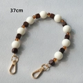 Detail view of 37cm beaded strap with white acrylic, amber resin, and brown wood beads - Style 3 / 40CM