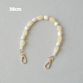 Detail van 38cm acryl kralenketting met gele harskralen en gouden karabijnsluitingen - Beige Onregelmatige Kralen Splicing Wit (2)