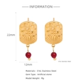 Detailed view of 18k gold stainless steel earrings with red ruby charms and star engraving - Starburst Relief With Red Bead Style (HE0046G)