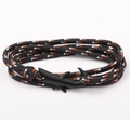 Detail of multi-layer black and orange woven rope bracelet with matte shark hook clasp - Shark Clasp / Black and White with Orange