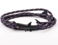 Detailed view of nautical navy braided rope bracelet with black shark-shaped metal hook - Shark Clasp / Navy with Red and White Dots