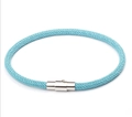 Macro view of light blue braided rope bracelet with polished silver magnetic clasp - Light Blue