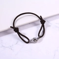 Detail of adjustable dark brown braided rope bracelet with silver handcuff metal clasp - Dark Brown