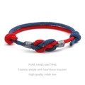 Detailed macro view of handcrafted red and blue woven knots on a couple's bracelet - Dark Blue And Red