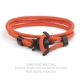 Pulsera hecha a mano de cuerda milanesa naranja con un cierre de tortuga marina negra - Naranja
