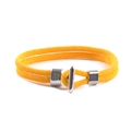 Detail of yellow woven cord bracelet featuring silver T-bar clasp and metal sliders - Yellow