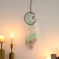 Detail of moon-shaped dreamcatcher with green webbing, beads, and hanging feathers - Gradient Green Without Lights
