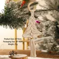 Detail view of handmade macrame Christmas tree ornament with beads and tassels - White