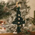 Detail view of handmade green cotton rope macrame Christmas tree ornament with wooden beads - Green