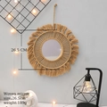 Detail of woven mirror measuring 26.5cm diameter with handmade cotton fringe - Coffee Tassel Style