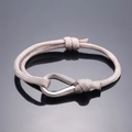 Pink braided rope bracelet with silver horseshoe buckle in a minimalist outdoor style - Silver Gray