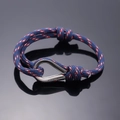 Adjustable navy blue braided rope friendship bracelet with silver U-shaped metal shackle - Navy Blue Red White Spots