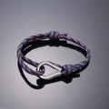 Adjustable navy woven rope bracelet with red and white accents and steel pear clasp - Blue Red White Pattern
