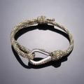 Army green woven rope bracelet with red and white accents and polished silver U-shackle clasp - Army Green Red White Pattern