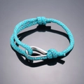 Teal braided paracord friendship bracelet with silver U-shaped metal shackle and sliding knots - Light Green Camouflage