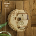 Detail showing carved moon face on a rustic wooden crescent shelf with crystal display - M01375 / Natural Wood Color