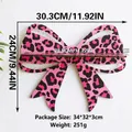Detail of pink leopard print bow shelf showing 30.3x24cm dimensions on white wall - Large Size (ms9826)