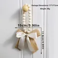 Macro shot of rustic wooden beads with a dual-layer burlap and satin bow wall hanging - Cream Satin Bow (ms9773)