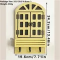 Gelbes Holzfenster-Wandregal mit 3 schwarzen Haken und Maßen 34,2 x 19,6 cm - Hellgelb