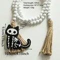 Detail of Halloween wood bead garland with rustic jute tassel and black skull cat pendant - Skeleton Cat Style (BS4348)