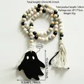 Macro shot of Halloween wood bead curtain tieback with cotton tassel and ghost pendant - Black White Grey Ghost Style (BS4350)