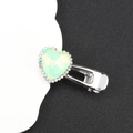 Detail view of heart-shaped silver clip with a light green gem and sparkling rhinestones - Green Single Heart
