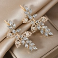 Elegant gold leaf hair clips with sparkling rhinestones for bridal wedding hairstyles - Gold Pair