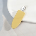 Barrette à cheveux mate jaune en forme de goutte sur un plateau en céramique - Jaune