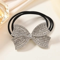 Elegant black elastic hair tie featuring a sparkling rhinestone-studded silver bow - Silver