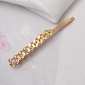 Gold chain hair clip with sparkling rhinestones shown on an elegant white silk background - Gold Style (C6404)