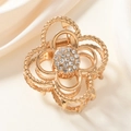 Eleganter goldener Haarklammer mit Blumenmuster und Strass auf Seide - Blumenstil