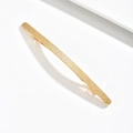 Minimalist gold zinc alloy hair clip with elegant diagonal wave pattern on white surface - Gold