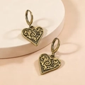 Vintage bronze heart earrings with intricate filigree patterns on display stand - Antique Gold Earrings (F1303)