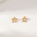 Orecchini a fiore dorati con zircone centrale e trama in metallo plissettato - Orecchini (Oro)