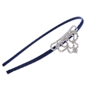Close-up of sparkling rhinestone crown detail on a navy blue satin fabric headband - Crown