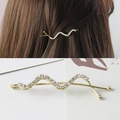 Elegante fermaglio per capelli ondulato dorato con strass scintillanti per donna - Oro