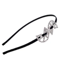 Close-up of black velvet headband featuring a large sparkling rhinestone bow and D logo - Silver Letter Design (C7501)