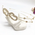 Detail of elegant gold double-layered headband featuring sparkling rhinestone heart motifs - Gold Bowknot (C7508)