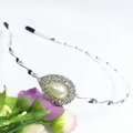 Silver twisted metal headband featuring a teardrop pearl and rhinestone embellishments - Silver (C8522)