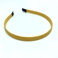 Detalle de la diadema de tela amarilla con textura mate y puntas negras antideslizantes - Amarillo